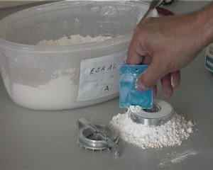Scraping off excess powder